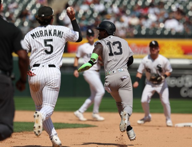 Chicago White Sox first baseman Munetaka Murakami (5) catches New York Yankees second baseman Jazz Chisholm Jr. (13) in a run down in the seventh inning Thursday, July 30, 2026, at Rate Field. (Brian Cassella/Chicago Tribune)