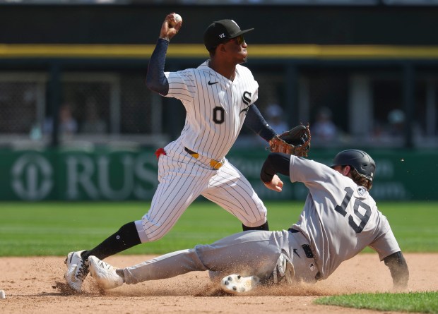 Chicago White Sox shortstop Luisangel Acuña (0) forces out New York Yankees third baseman Ryan McMahon (19) in the tenth inning Thursday, July 30, 2026, at Rate Field. (Brian Cassella/Chicago Tribune)