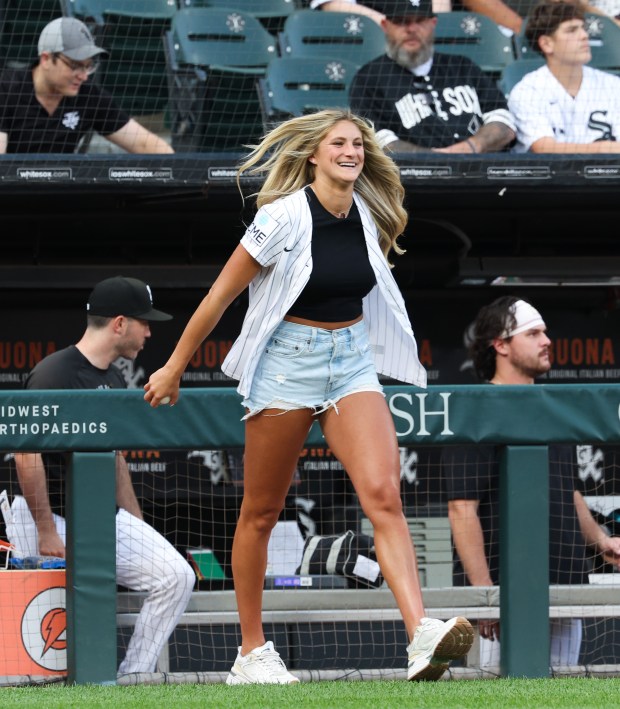 Chicago Sky player Jacy Sheldon heads to the mound to throw out a ceremonial first pitch before a White Sox-Yankees game at Rate Field on July 28, 2026, in Chicago. (John J. Kim/Chicago Tribune)