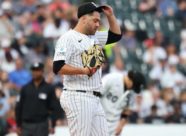 White Sox starting pitcher Anthony Kay adjusts his cap after throwing a wild pitch, resulting in two Yankees runners advancing bases, in the second inning at Rate Field on July 28, 2026, in Chicago. (John J. Kim/Chicago Tribune)