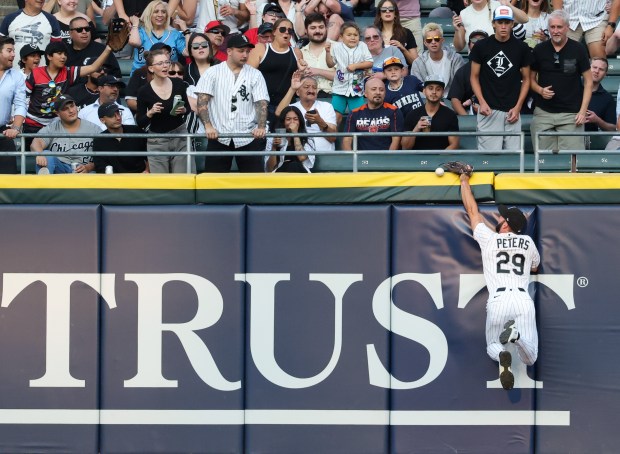 White Sox center fielder Tristan Peters narrowly misses a ball hit for an RBI double by Yankees shortstop Anthony Volpe in the second inning at Rate Field on July 28, 2026, in Chicago. (John J. Kim/Chicago Tribune)