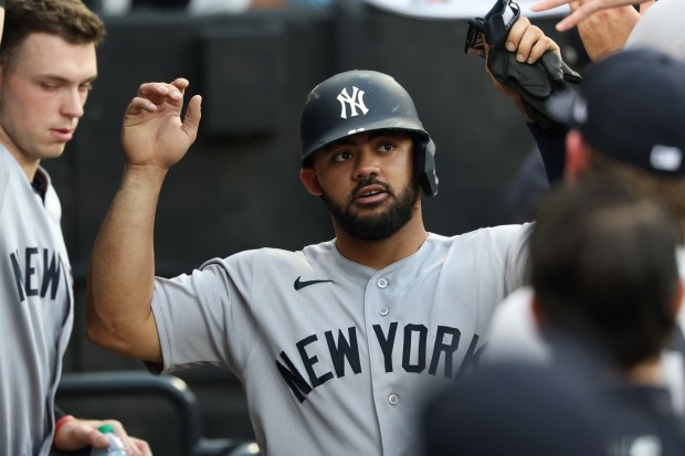 Yankees right fielder Jasson Domínguez celebrates after scoring on a double by shortstop Anthony Volpe in the second inning against the White Sox at Rate Field on July 28, 2026, in Chicago. (John J. Kim/Chicago Tribune)
