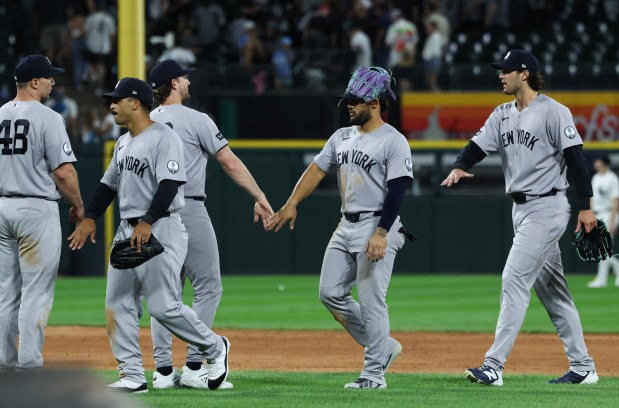 Yankees players celebrate a 3-2 win over the White Sox at Rate Field on July 28, 2026, in Chicago. (John J. Kim/Chicago Tribune)