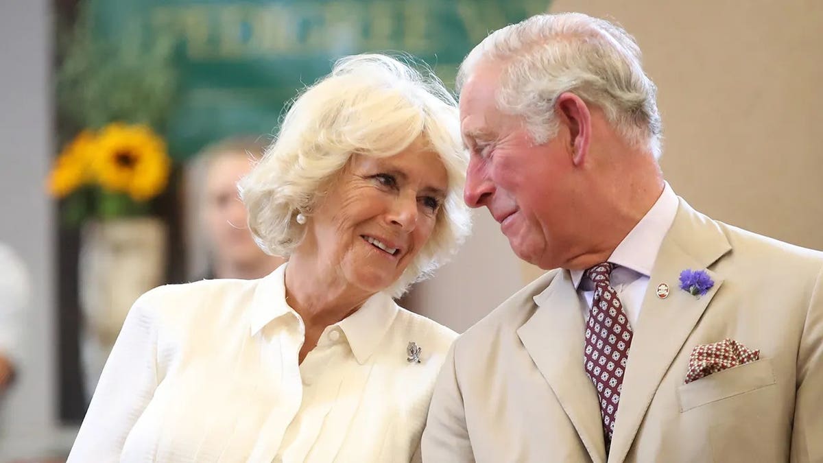 Queen Camilla and King Charles staring adoringly at each other.