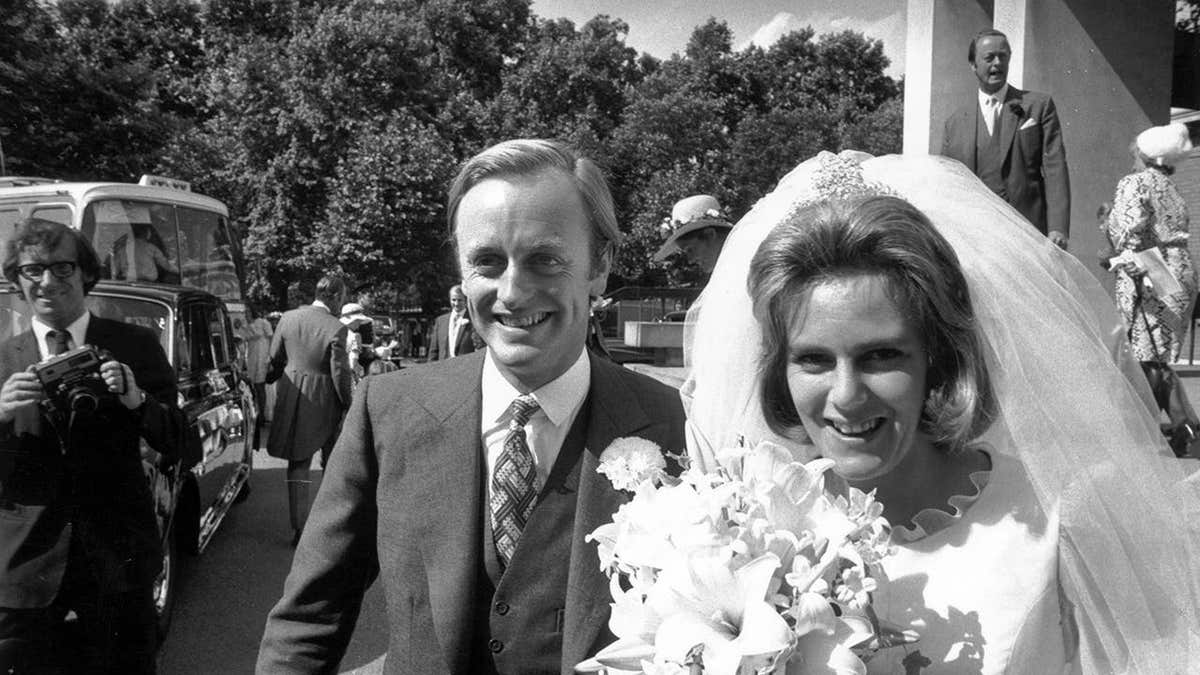 Camilla Shand and Captain Andrew Parker Bowles stand outside the Guards' Chapel.