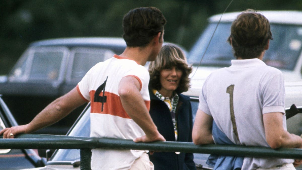 Prince Charles chats at a polo match.