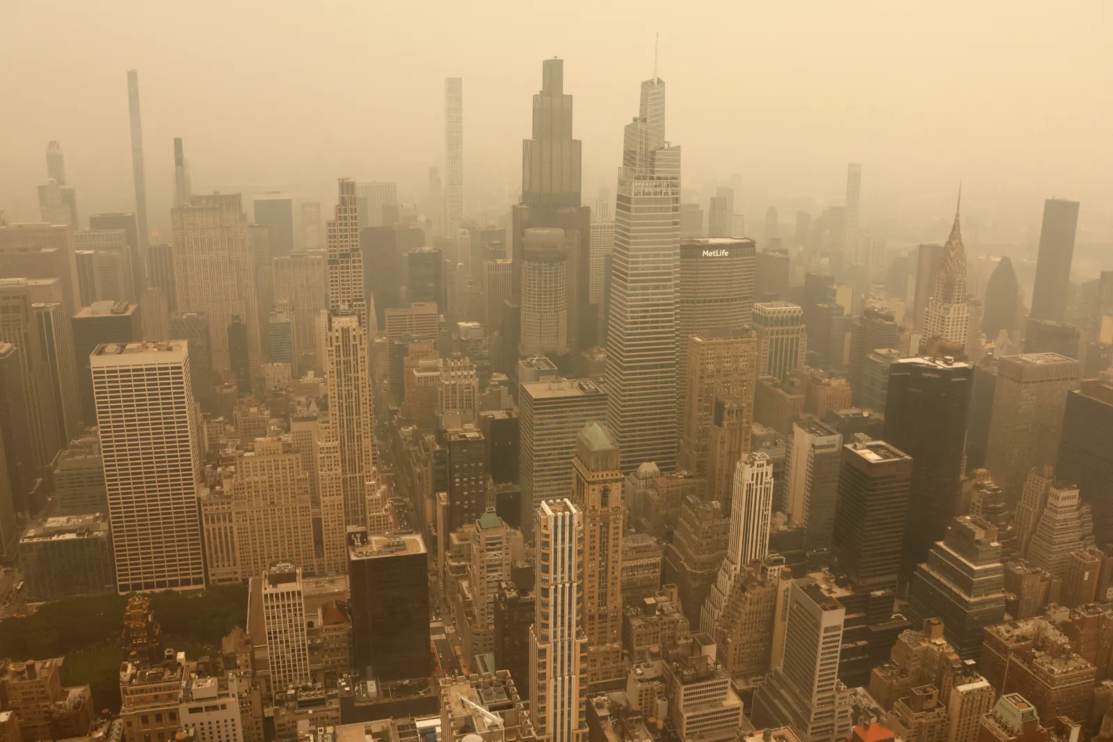 Smoke from wildfires in Canada shrouds the view north to midtown Manhattan, seen from the 86th-floor observation deck of the Empire State Building before sunset on July 15, 2026, in New York City | Photo by Gary Hershorn/Getty Images
