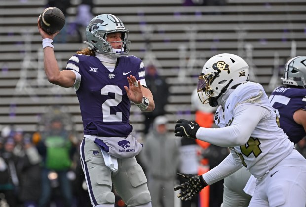 MANHATTAN, KS - NOVEMBER 29: Quarterback Avery Johnson #2 of the Kansas State Wildcats throws a pass against defensive end London Merritt #44 of the Colorado Buffaloes in the first half at Bill Snyder Family Football Stadium on November 29, 2025 in Manhattan, Kansas. (Photo by Peter Aiken/Getty Images)