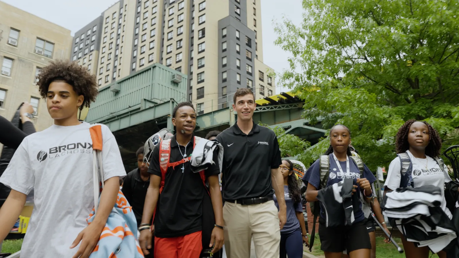 Leventhal, pictured here with students participating in the Bronx Lacrosse program, was a lacrosse player himself while in college.