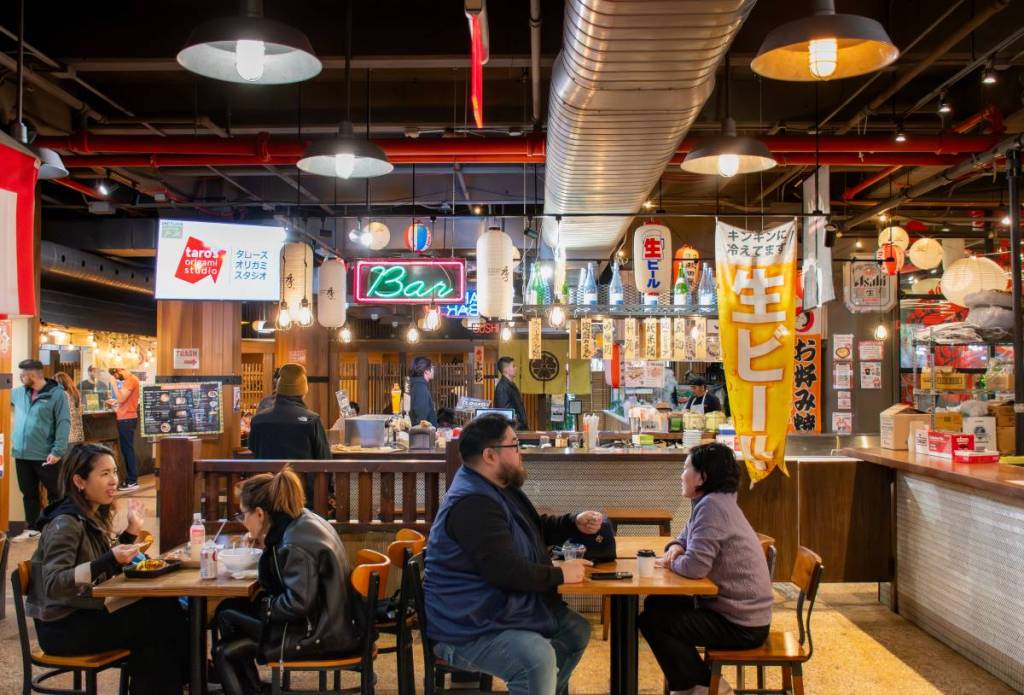 food hall and restaurants and people eating at Japan Village
