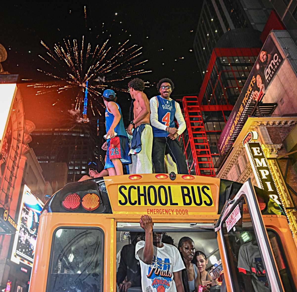 Knicks fans celebrate atop school bus in Manhattan
