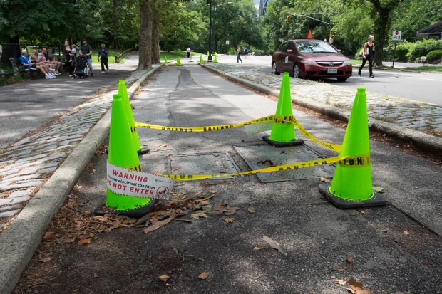 Caution tape and a warning sign around an electrical vault on West Drive in Central Park. (Evan Simko-Bednarski/New York Daily News)
