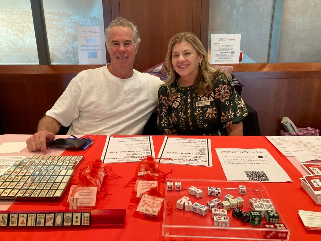 A man and woman at a red table