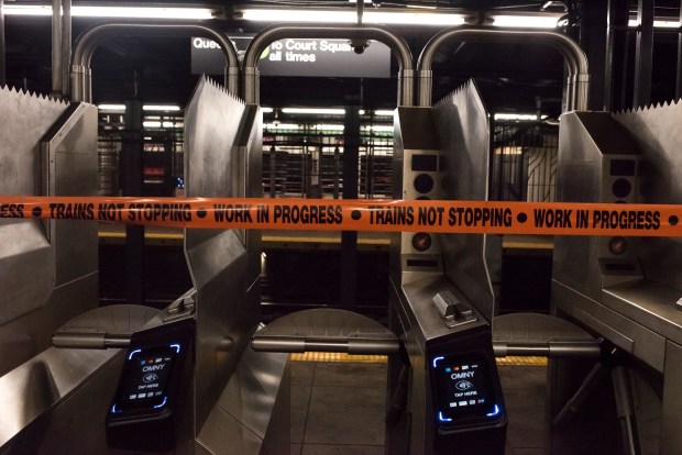 Caution tape reminds straphangers at the Greenpoint Ave. subway station that G trains are not running. The MTA is taking the train out of service for eight weekends this year in order to conduct upgrade work and repairs. (Evan Simko-Bednarski / New York Daily News)