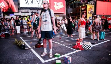 Actors perform in Philly artist Maia Chao's 2025 work "American Idle" in Times Square. The performance will be restaged on August 14, 2026.