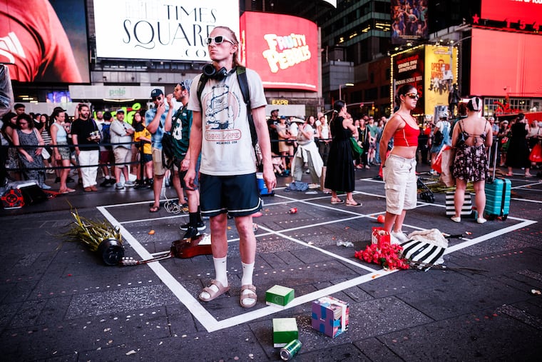 Actors perform in Philly artist Maia Chao's 2025 work "American Idle" in Times Square. The performance will be restaged on August 14, 2026.