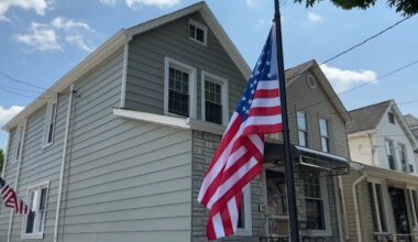A flag flies at half-staff in front of the home of 28-year-old Sgt. Angel Sarah Rampersad, who was killed in action on Friday, July 17, during an Iranian ballistic missile and drone attack on a military base in Jordan. (Spectrum News NY1)