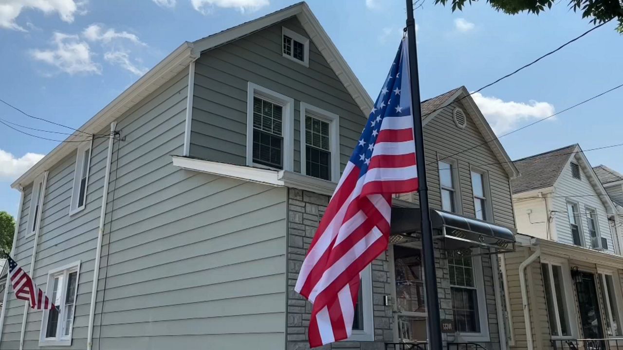 A flag flies at half-staff in front of the home of 28-year-old Sgt. Angel Sarah Rampersad, who was killed in action on Friday, July 17, during an Iranian ballistic missile and drone attack on a military base in Jordan. (Spectrum News NY1)