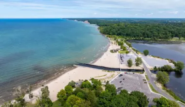 One of New York's largest freshwater beaches is tucked along Lake Ontario—with sandy shores, waterfront camping & unforgettable sunsets