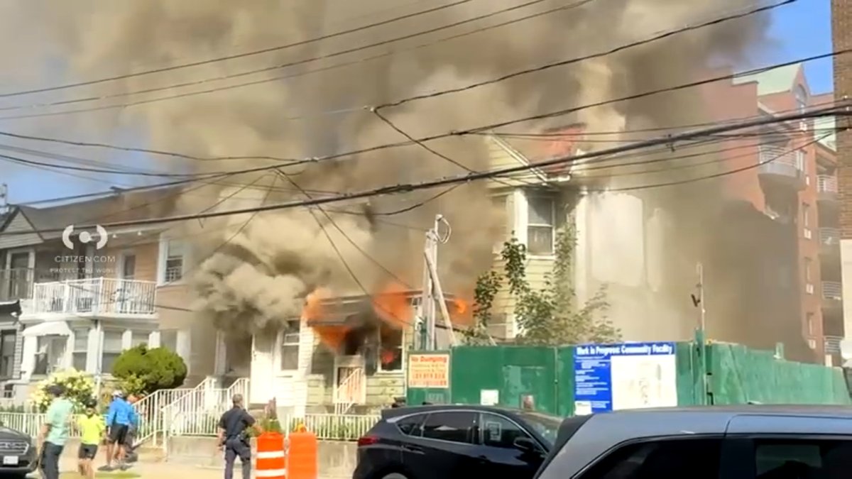 Five-alarm fire rips through Flushing home, jumps to other buildings – NBC New York
