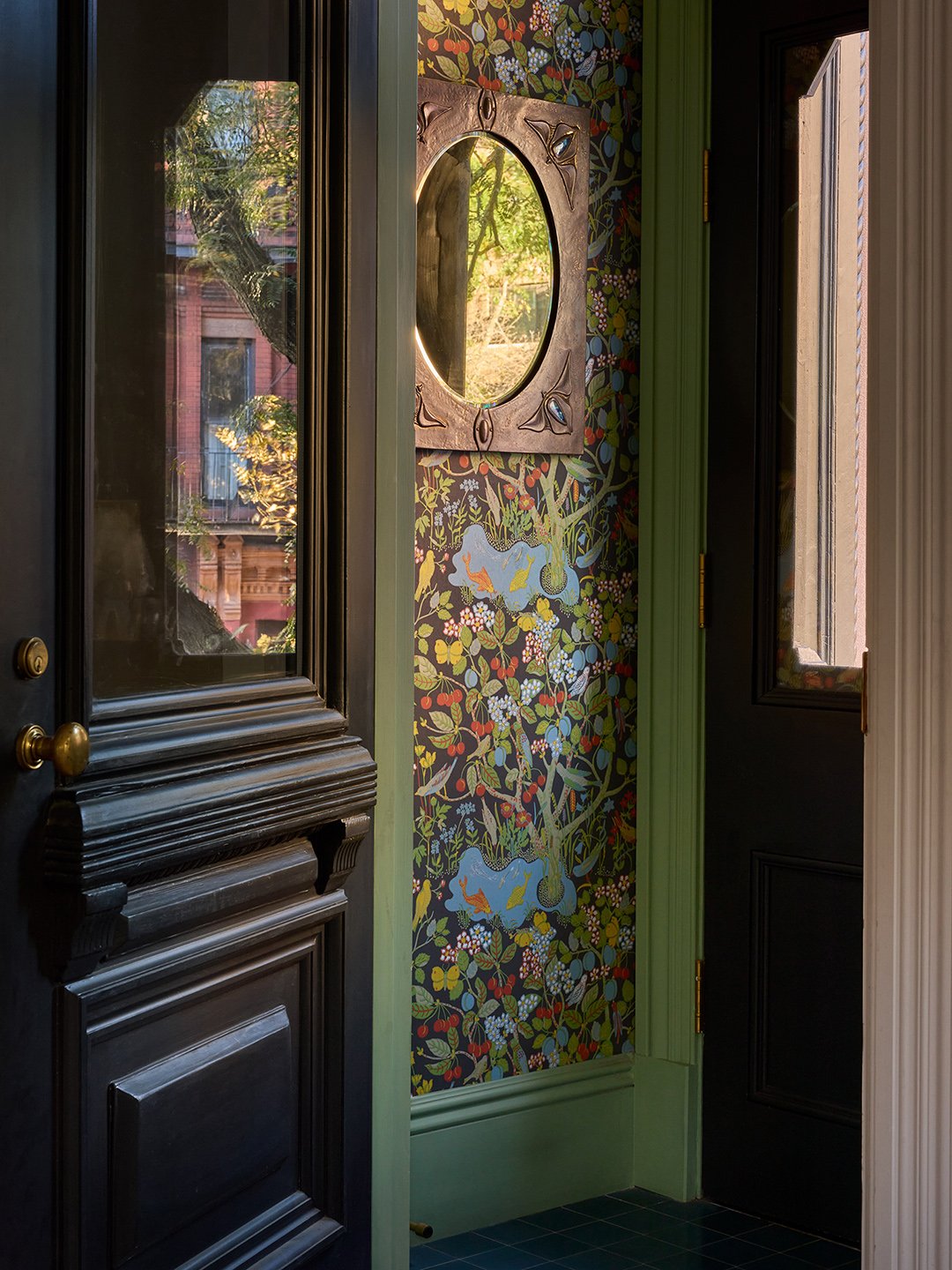 foyer with patterned wallpaper