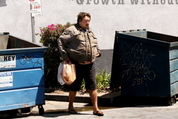 FILE - Andrew Truelove exits an area where he relieved himself behind a dumpster in Torrance, California, on July 18, 2023, during a feature story profile on homelessness by the Los Angeles Times. (Genaro Molina/Los Angeles Times via Getty Images)
