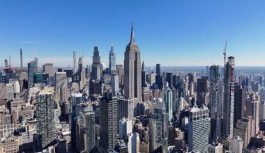 BREAKING: 2 people scale the Empire State Building’s needle to wave peace banner in apparent engagement stunt