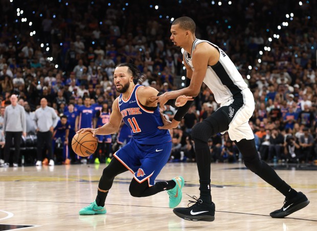 SAN ANTONIO, TEXAS - JUNE 13: Jalen Brunson #11 of the New York Knicks drives to the basket against Victor Wembanyama #1 of the San Antonio Spurs during the fourth quarter in Game Five of the 2026 NBA Finals at Frost Bank Center on June 13, 2026 in San Antonio, Texas. NOTE TO USER: User expressly acknowledges and agrees that, by downloading and or using this photograph, User is consenting to the terms and conditions of the Getty Images License Agreement. (Photo by Gregory Shamus/Getty Images)