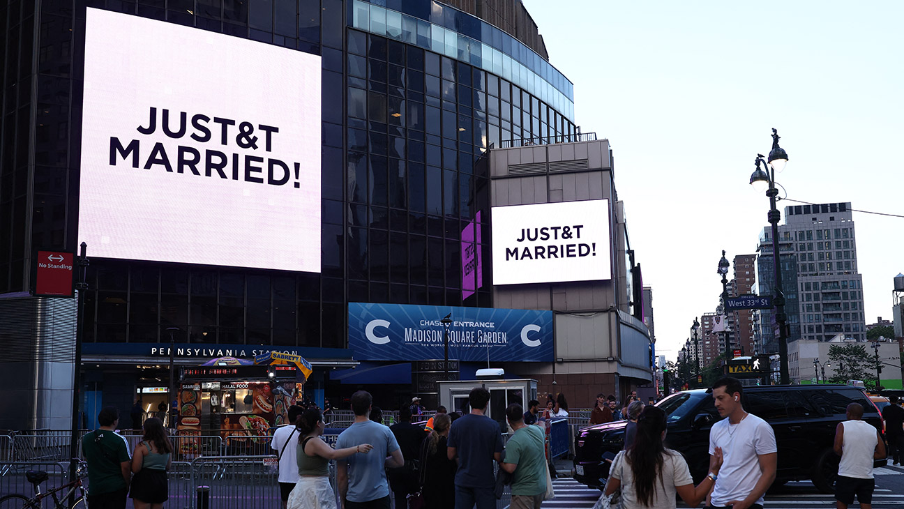 A message on the video screens outside Madison Square Garden announces that Taylor Swift and Travis Kelce are married.