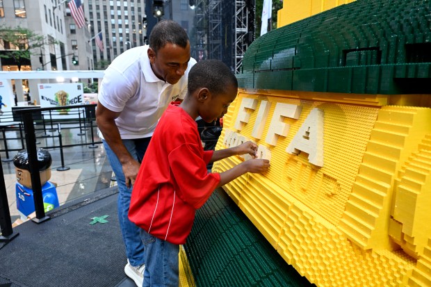 NEW YORK, NEW YORK - JULY 06: Football legend Cafu joins fans as the LEGO Group unveils the world's biggest FIFA World Cup Trophy™ in New York City on July 06, 2026 in New York, New York. (Photo by Eugene Gologursky/Getty Images for LEGO Group)
