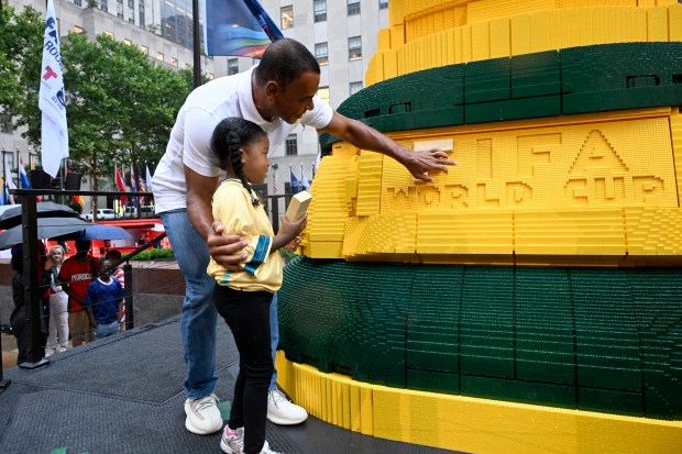 NEW YORK, NEW YORK - JULY 06: Football legend Cafu joins fans as the LEGO Group unveils the world's biggest FIFA World Cup Trophy™ in New York City on July 06, 2026 in New York, New York. (Photo by Eugene Gologursky/Getty Images for LEGO Group)