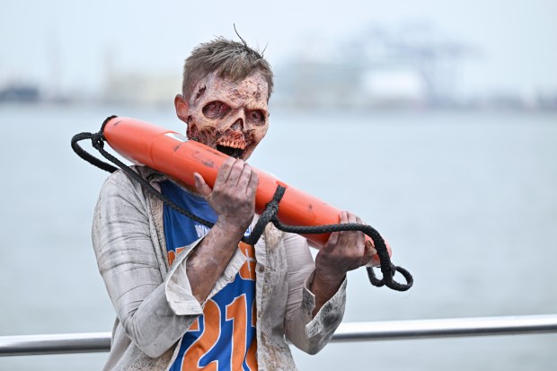 NEW YORK, NEW YORK - JULY 11: Walkers ride the water taxi during the Dead City NYC Activation on July 11, 2026 in New York City. (Photo by Roy Rochlin/Getty Images for AMC Global Media )