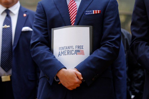 Terrance Cole, Administrator of the US Drug Enforcement Administration (DEA), holds a folder reading "Fentanyl free America" during a news conference with law enforcement officials outside the federal courthouse in Brooklyn on July 20, 2026. (Photo by Leonardo MUNOZ / AFP via Getty Images)