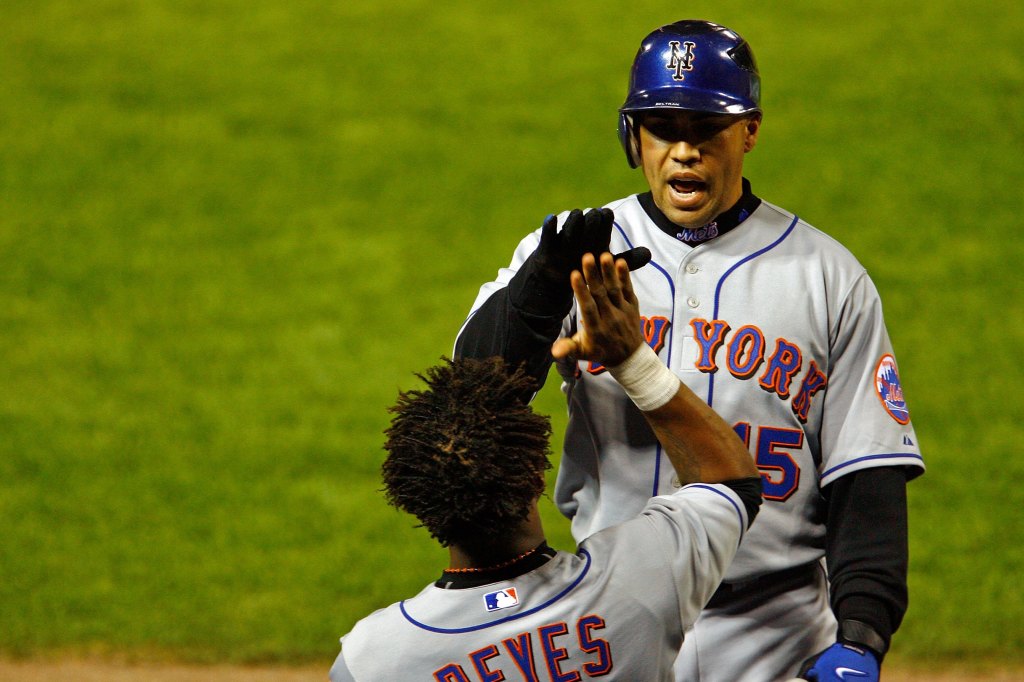 Carlos Beltran with Jose Reyes of the New York Mets celebrates after hitting a solo home run in the seventh inning against the St. Louis Cardinals during Game 4 of the NLCS at Busch Stadium on October 15, 2006 in St. Louis, Missouri.  