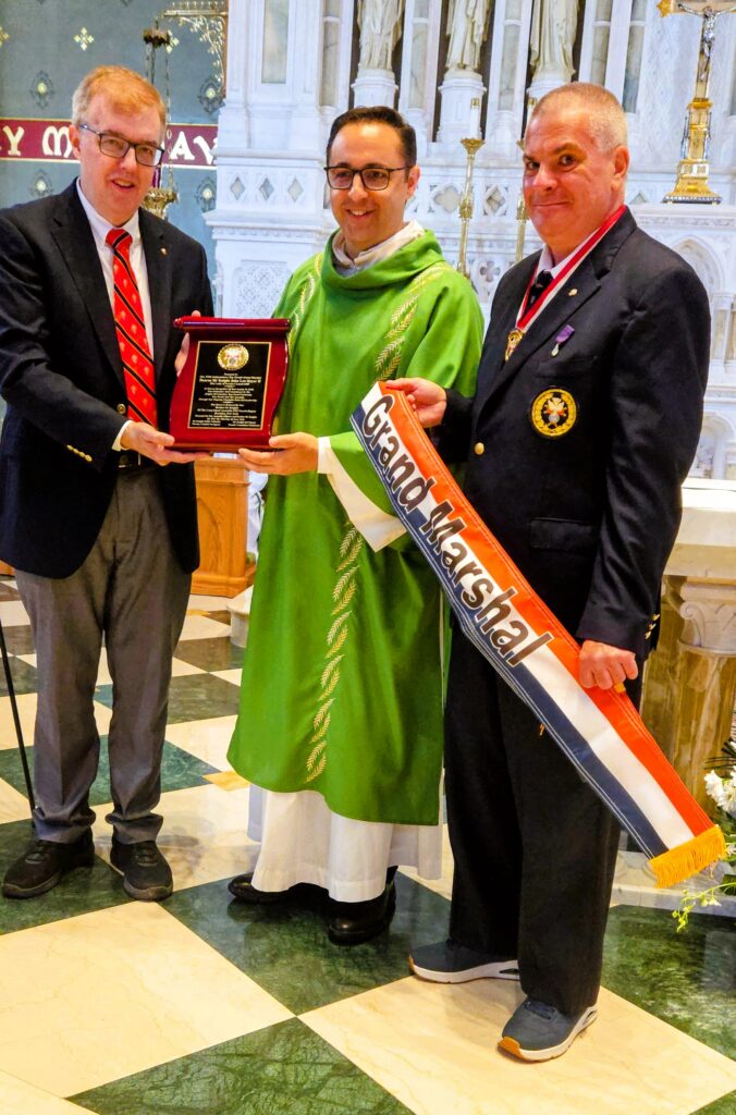 Knights honor grand marshal at pre-parade Mass