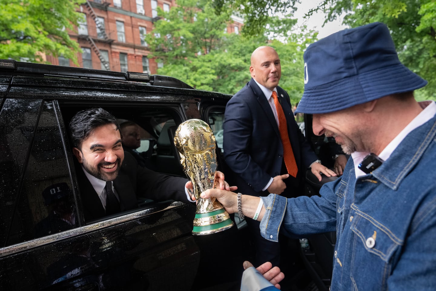 Mamdani was passed a replica World Cup trophy after making an announcement in May.