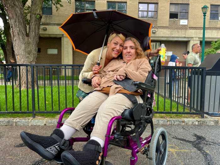 Kristin Ankuta (left) and her sister Nicole Barbara (right) came out in the rain to speak about their concern over Legionella contamination in Haven Plaza's water source and what Ankuta said was a complete lack of communication from Wavecrest Management.  