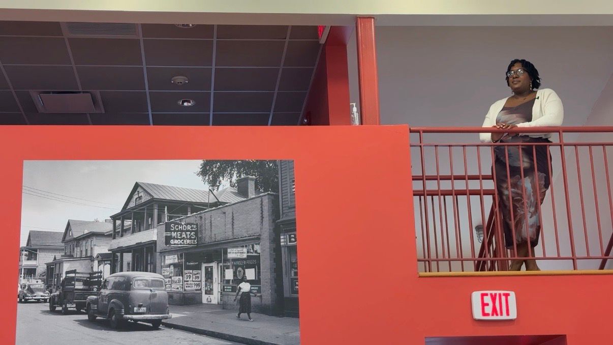Executive Director Sequoia Kemp looks out over the cafe. (Spectrum News 1/Natalie Mooney)