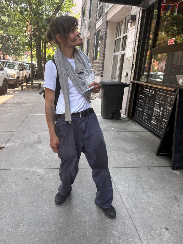 Edwin Rivera with an icy cup of water. (Roni Jacobson / New York Daliy News)