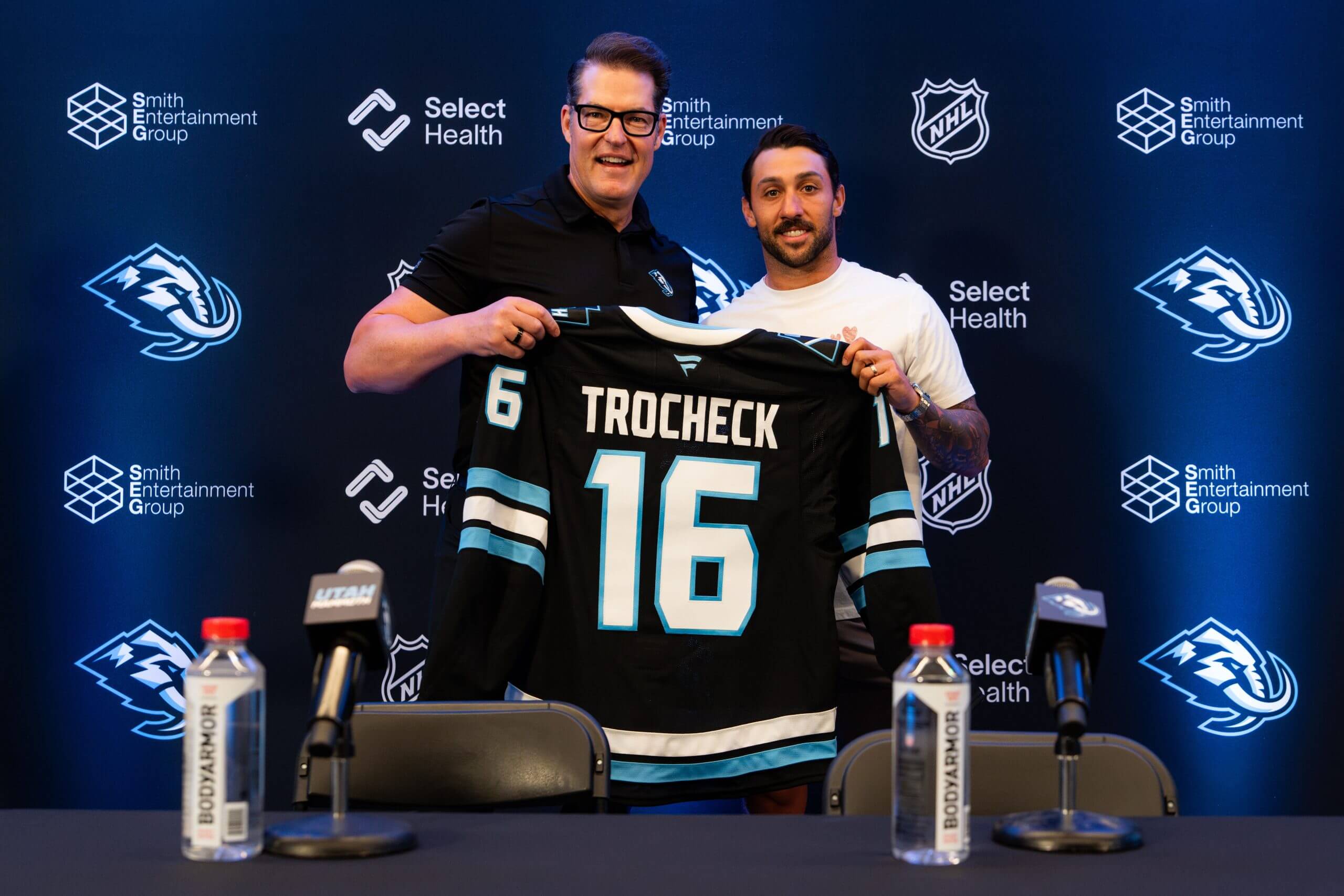Vincent Trocheck poses with his No. 16 Utah Mammoth jersey after his introductory news conference following a trade from the New York Rangers.
