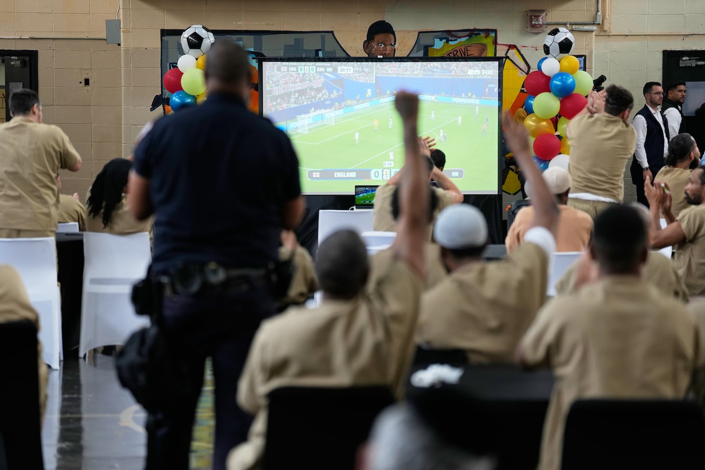 Rikers Island inmates react as New York City Mayor Zohran Mamdani, not pictured, leaves the jail complex during a World Cup semifinal soccer match watch party for the game between England and Argentina, in New York.