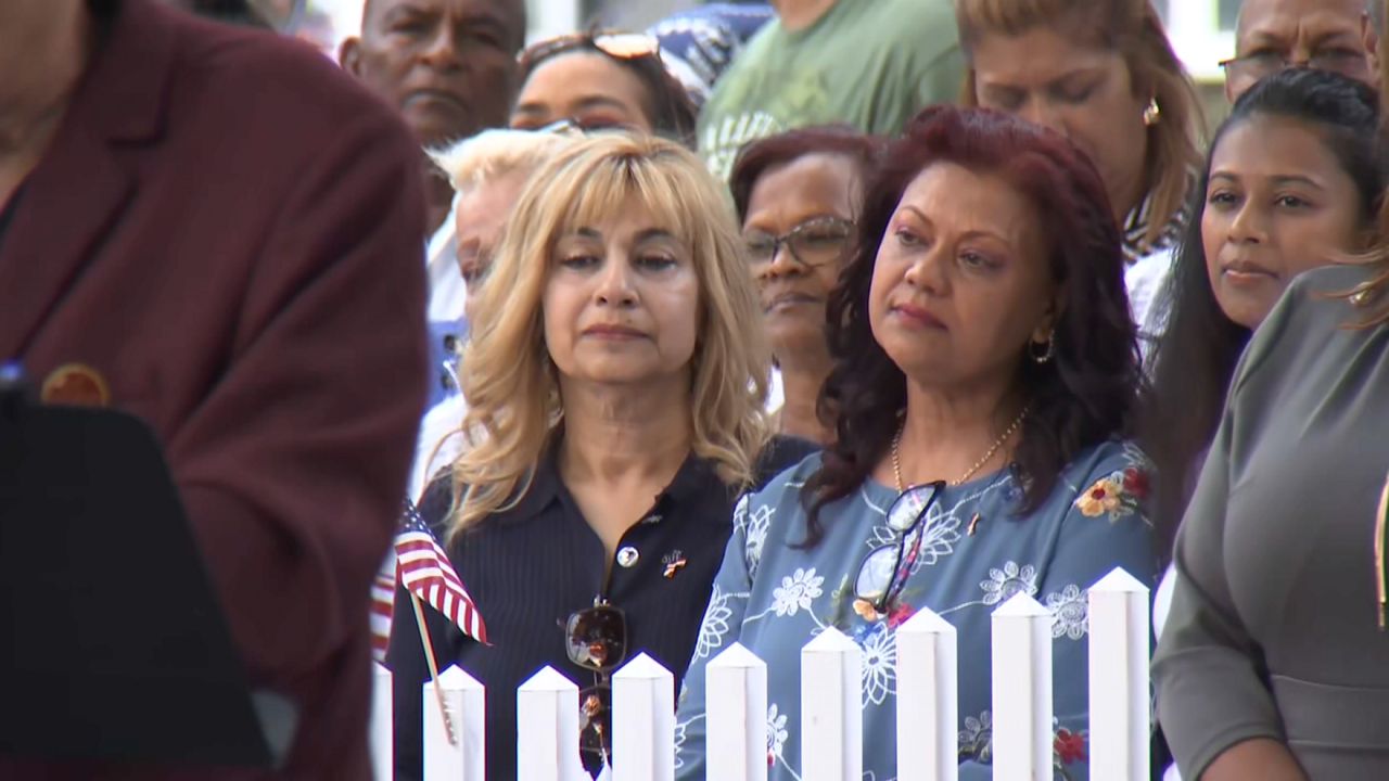 Neighbors gathered Monday night for a soldier many had never met. (Spectrum News NY1/Louis Finley)