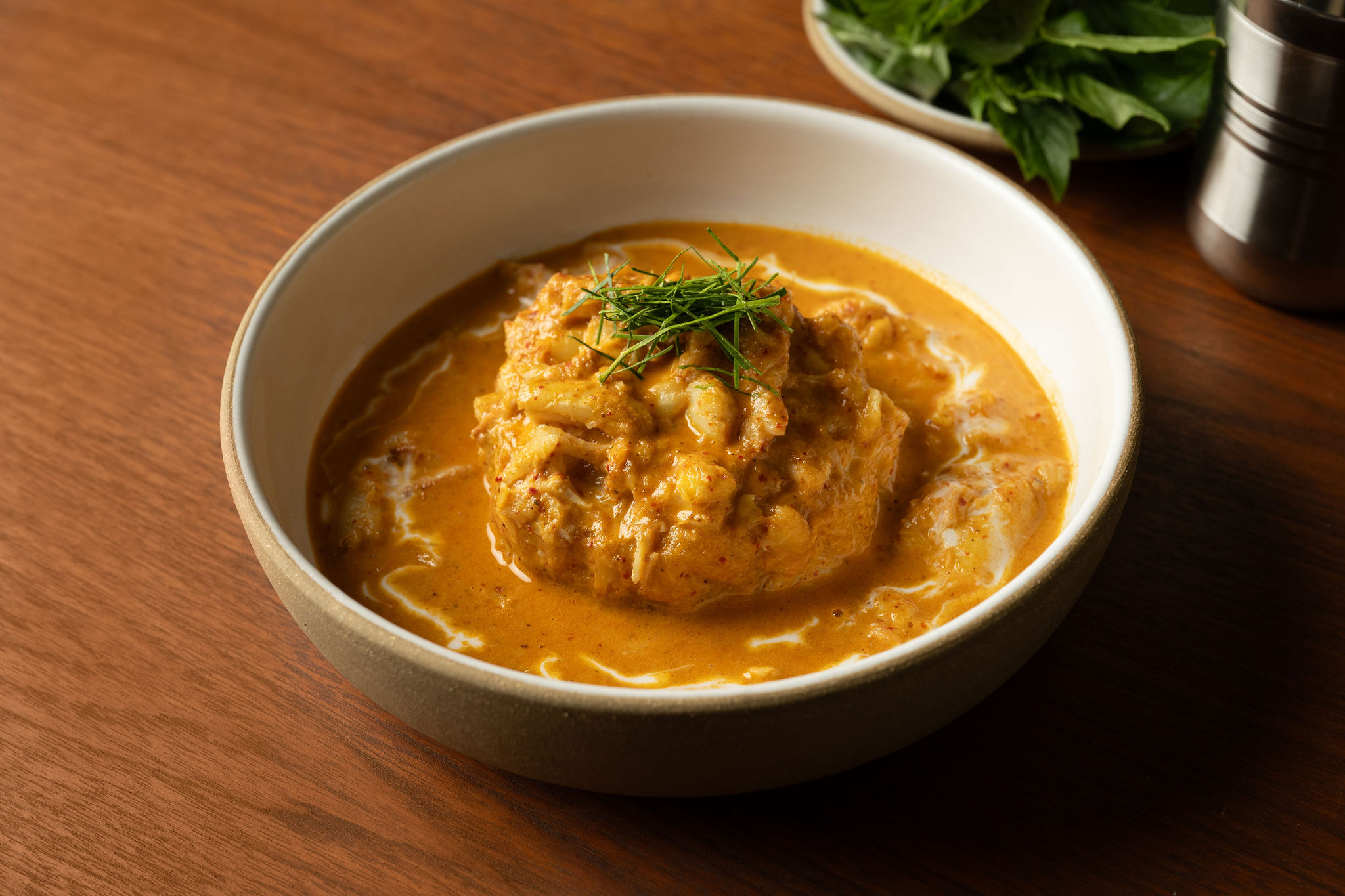 A bowl of curry and durian.