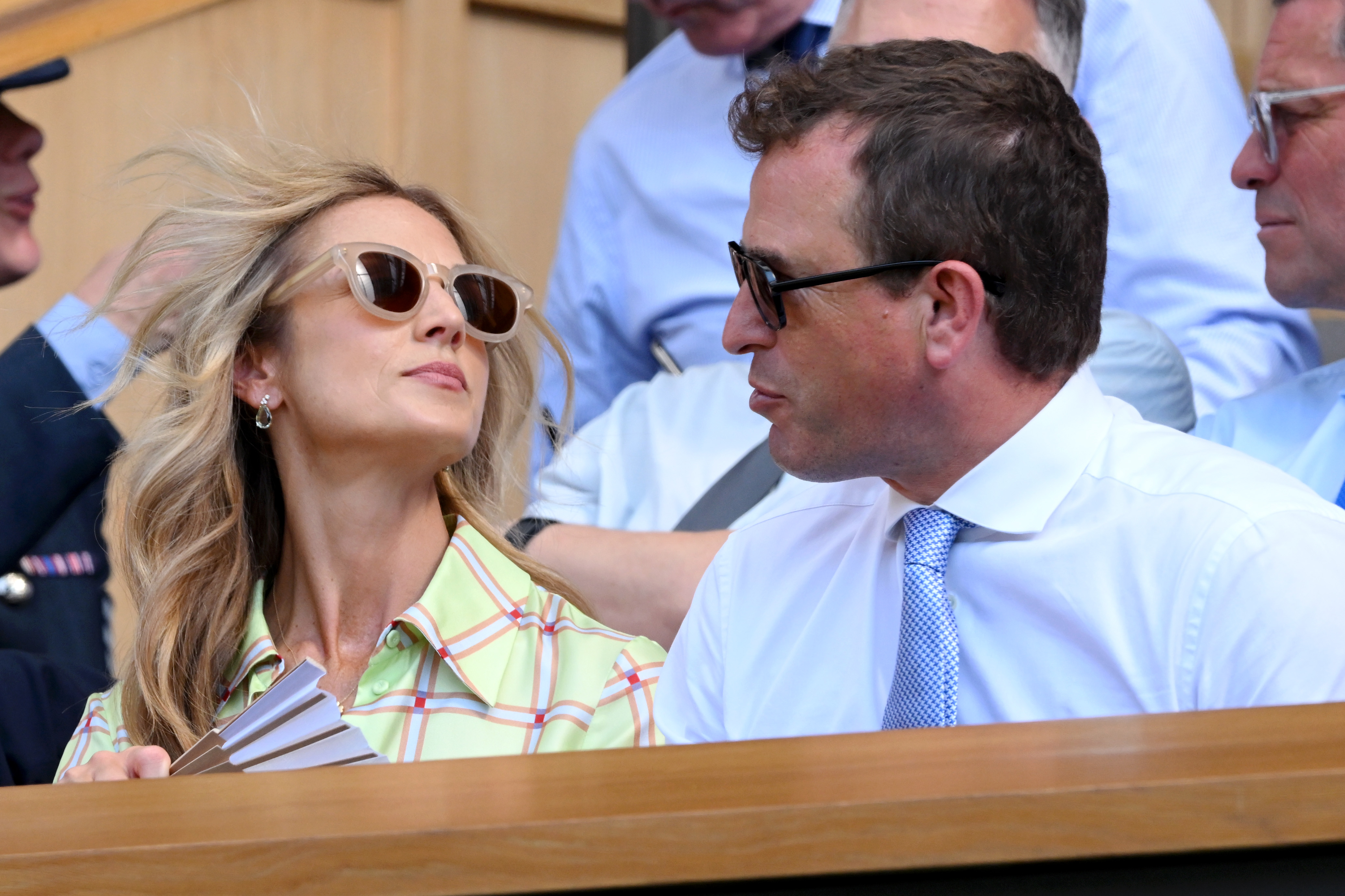 Harriet Sperling's hair blowing in the breeze sitting next to Peter Phillips at Wimbledon