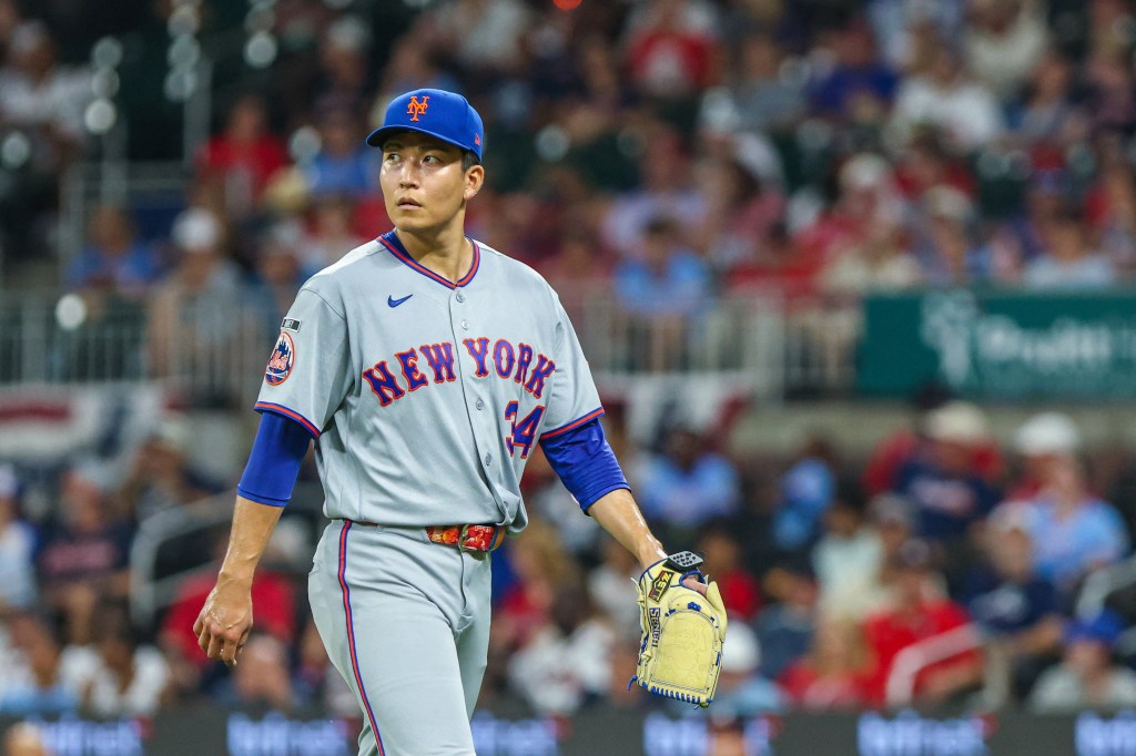 New York Mets pitcher Kodai Senga (34) walks to the dugout after pitching against the Atlanta Braves during the seventh inning at Truist Park.