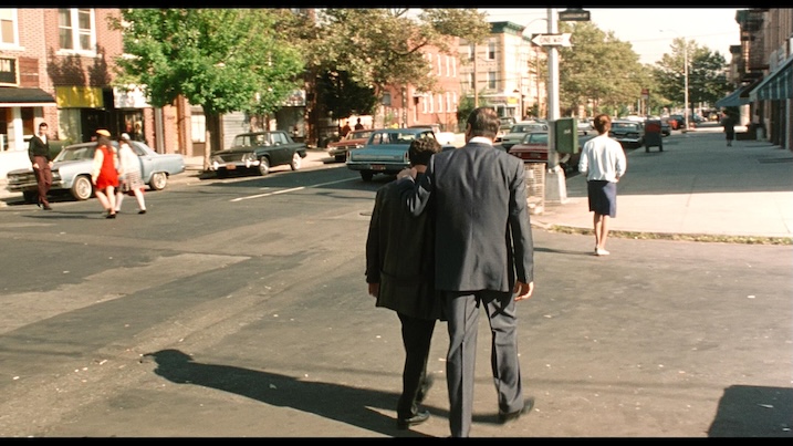 Sonny walks arm in arm with Calogero through a Bronx neighborhood in Robert De Niro's A Bronx Tale.