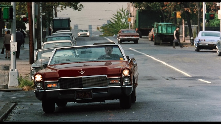 Calogero drives a red Cadillac convertible through the Bronx in a scene from A Bronx Tale.
