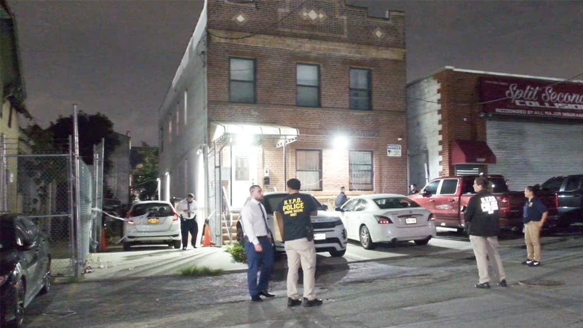 image shows police on scene of investigation