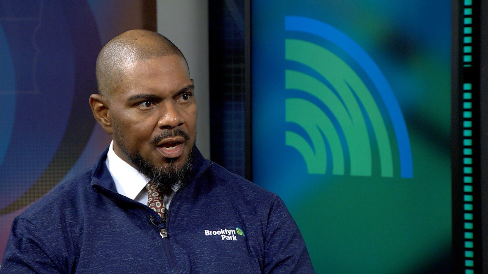 man being interviewed in a television studio