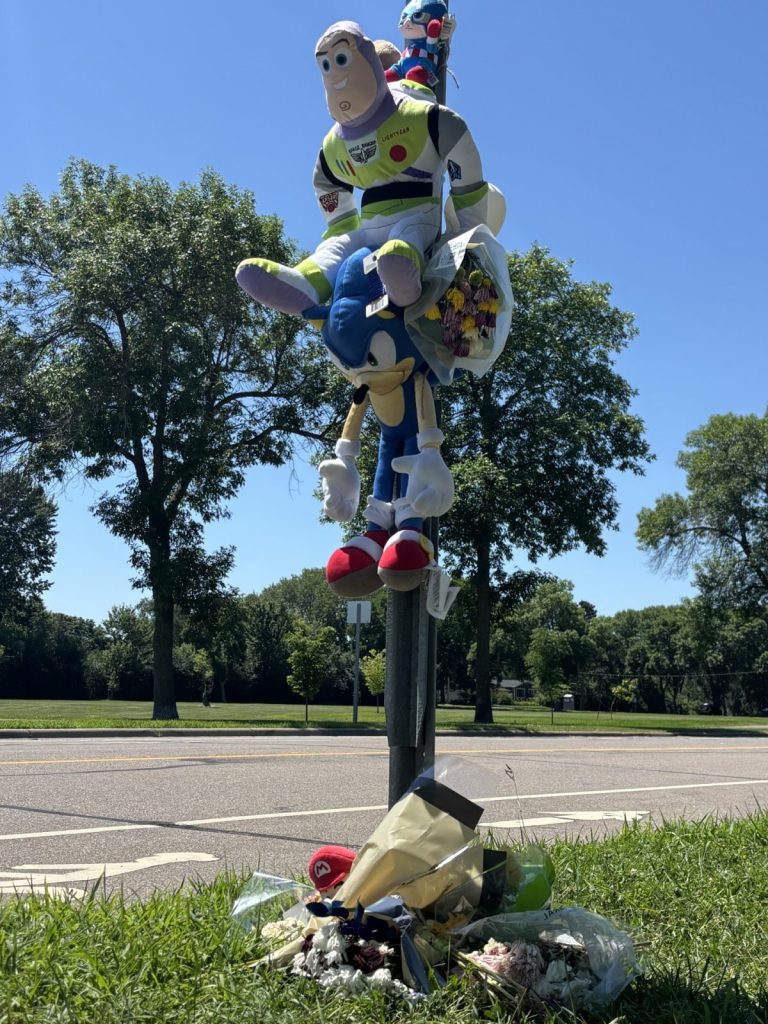 A memorial honors boy at intersection in Brooklyn Park